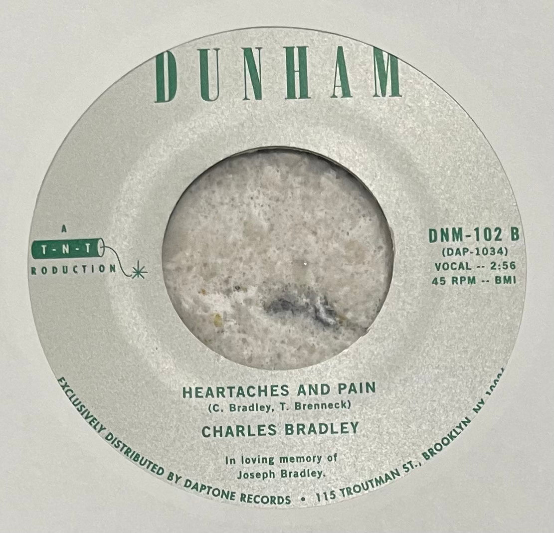 Charles Bradley - The World (Is Going Up In Flames) b/w Heartaches & Pain
